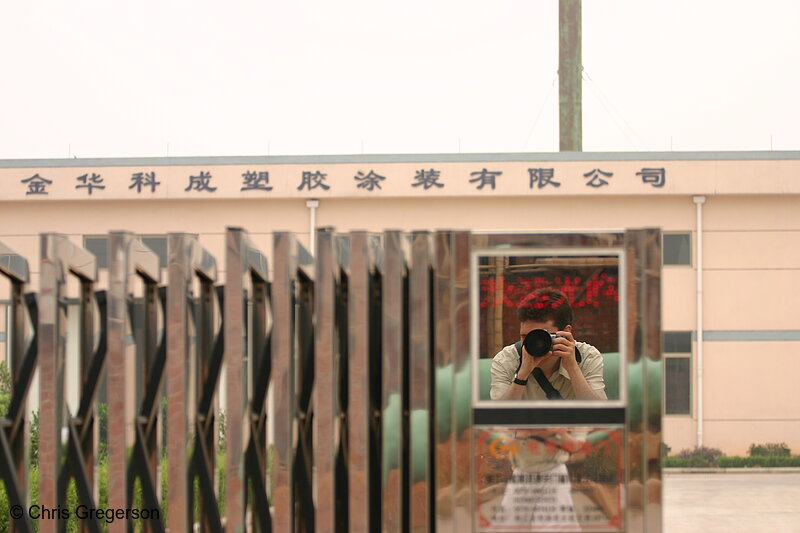 Photo of Chris in Reflection Outside Factory in China(3345)