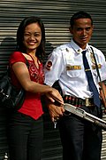 Woman with Bank Guard, the Philippines