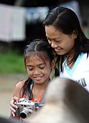 Asian Girl and Woman with Digital Camera