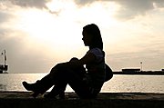 Female Profile Against the Ocean Sunset