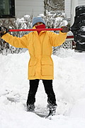 Victorious Woman Shovelling Snow
