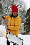 Woman Shovelling Snow