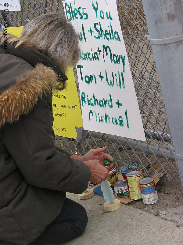 Photo of Woman Lighting Candle, Wellstone Memorial(2491)