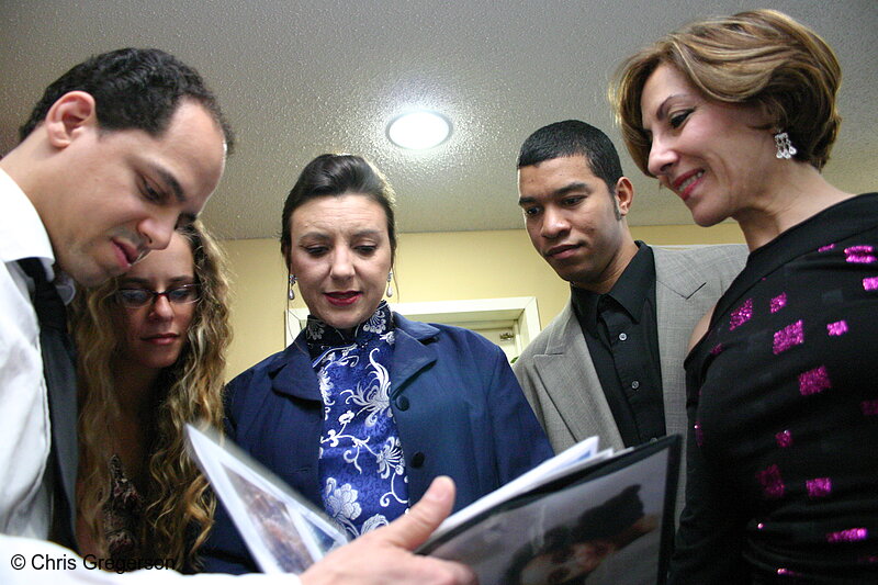 Photo of Group Looking at Album Together(3082)