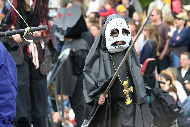 Photo of Child in May Day Parade, Wearing Mask and Dressed in Black(3207)