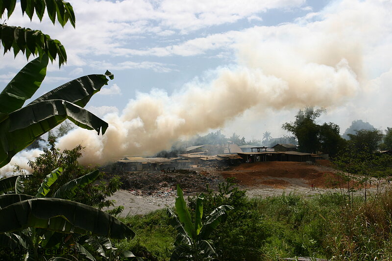 Photo of Smoke Over Shanties on Riverbank(4649)