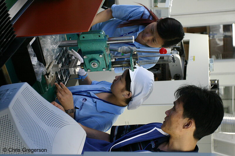 Photo of Electronics Factory Worker being Instructed(4886)