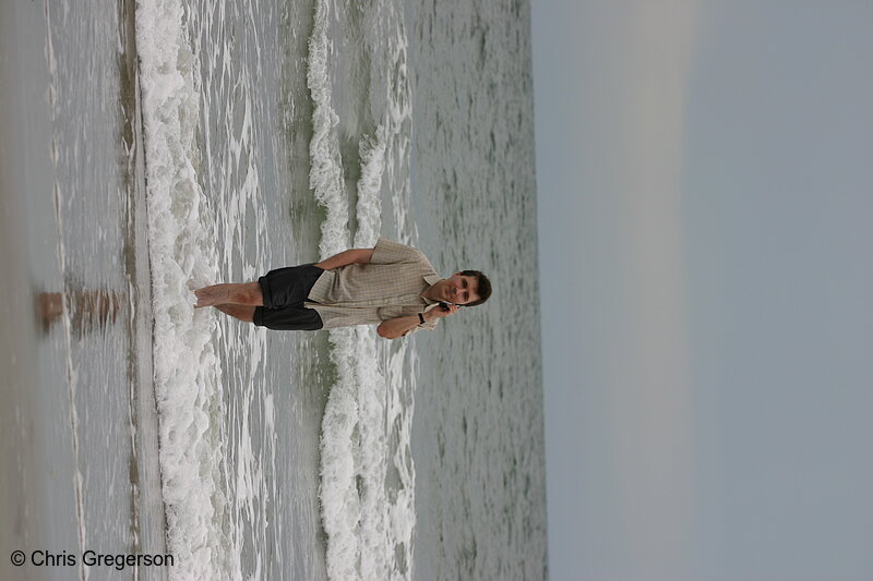 Photo of Man Walking on Beach, Talking on Cell Phone(4973)