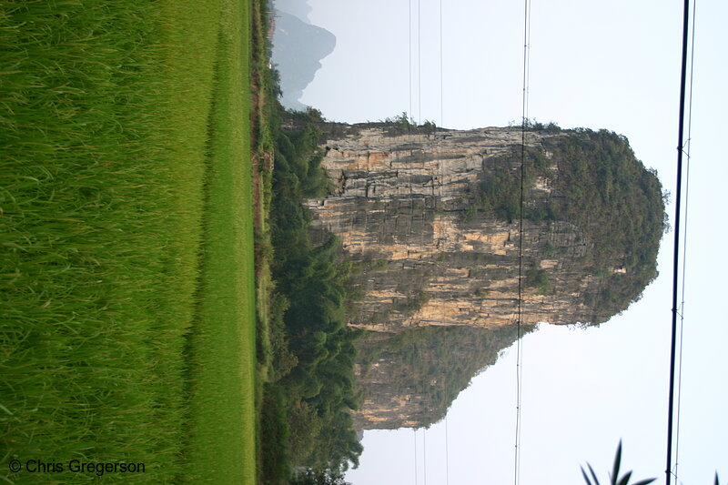 Photo of Steep, Dramatic Kurst Mountain Rising Above Farm Field(5054)