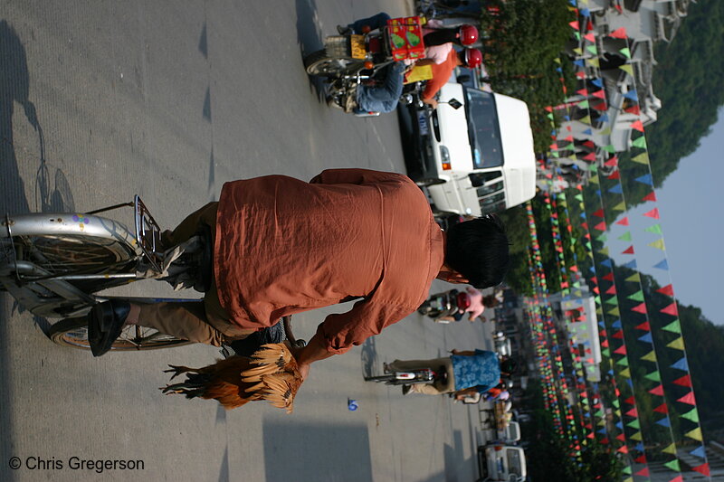 Photo of Man Bicycling Home with a Chicken(5065)