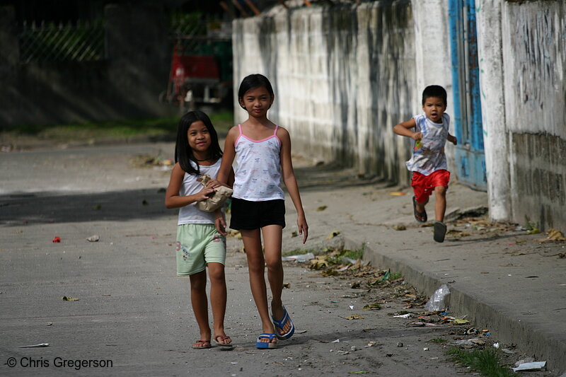 Photo of Picture of Two Children Walking and Another Running on a Street, Angeles City(5273)