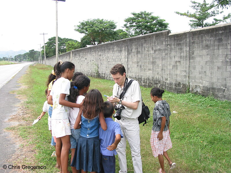 Photo of Chris Jotting Down Names of Aeta Kids in the Philippines(5999)
