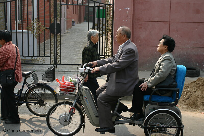 Photo of Old Chinese Couple Traveling on a Bicycle(6052)