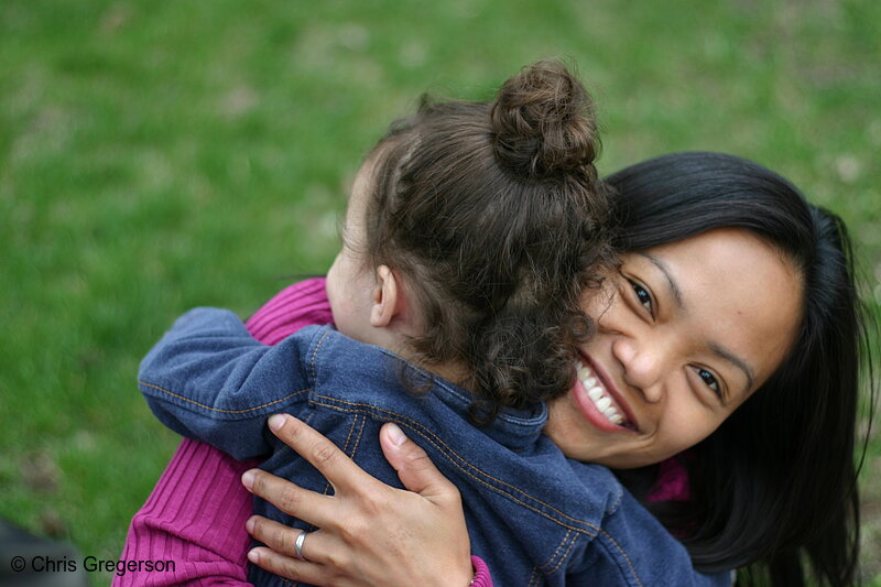 Photo of Young Woman and Child Hugging(6825)