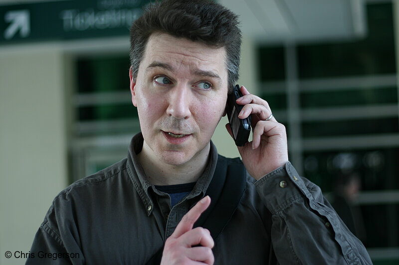 Photo of Traveler Talking on Cell Phone at the Airport(6832)