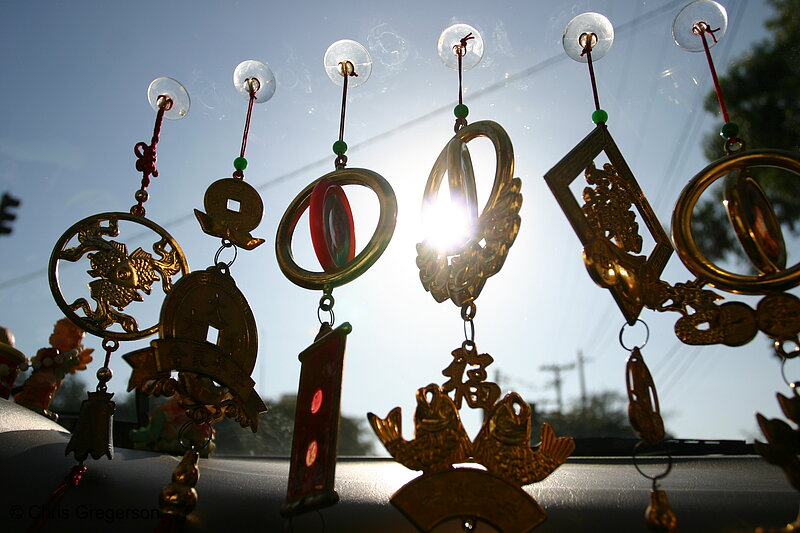 Photo of Medallions Hanging in a Manila Taxi(7804)