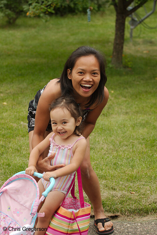 Photo of Mother and Daughter Playing in a Yard(8019)