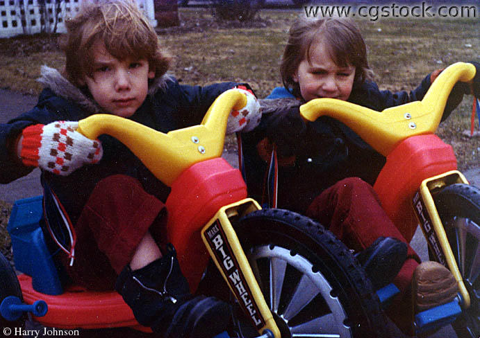 Littel Kids (Brothers) on their Big Wheels