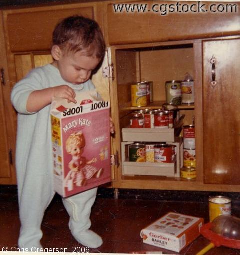 Marc as a Toddler Exploring Kitchen Cabinets