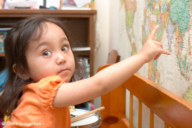 Preschool Girl Pointing to the Philippines on a World Map